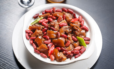 Red bean pig face and head meat on a white porcelain plate