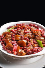 Red bean pig face and head meat on a white porcelain plate
