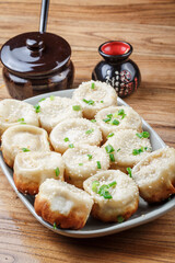 Shanghai style pan-fried buns on a porcelain plate