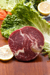 Australian ribeye steak on a wooden cutting board