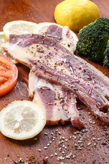 Australian beef ribs on a wooden chopping board
