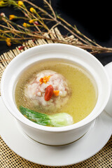 Fresh chicken soup with sunflower and crab meat
