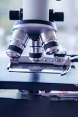 Vertical Horizon Science laboratory chemistry test science lab with microscope glass tubes on white table scientific background. Vertical Colorful Liquid biology scientist laboratory chemical fluid
