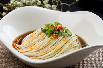 Shredded melon in a flower-shaped white porcelain plate