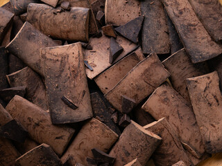 Chunk of cacoa mass bar or cocoa liquor. 100% pure cocoa chocolate.