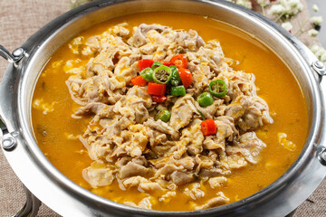 Sour lamb soup in stainless steel cutlery