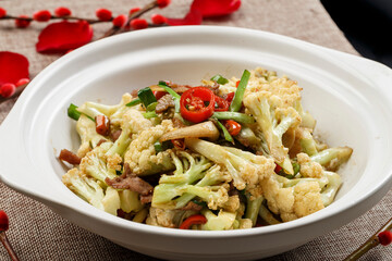Dry pot organic cauliflower in white casserole