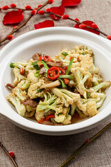 Dry pot organic cauliflower in white casserole