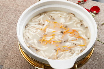 Cordyceps flower wild mushroom soup in a white porcelain bowl
