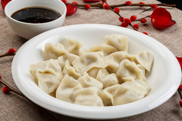 Handmade pork dumplings on a white porcelain plate