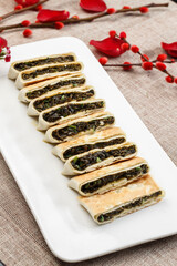 Egg and vegetable pie on a white porcelain plate