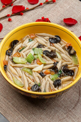 Raw fish in a yellow porcelain bowl