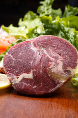 Australian ribeye steak on a wooden cutting board