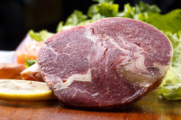 Australian ribeye steak on a wooden cutting board