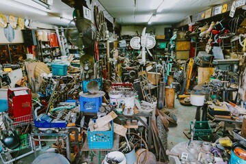 A cluttered workshop in Montreal, Quebec, Canada, filled with tools, equipment, and various...