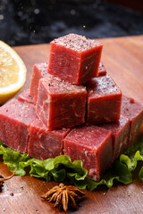 Beef leg steak on a wooden cutting board