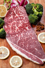 Beef rump on a wooden cutting board