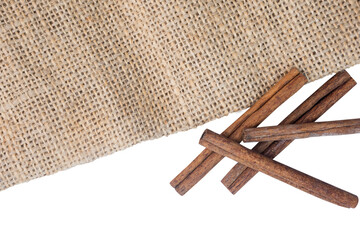 cinnamon sticks on burlap fabric with a transparent background
