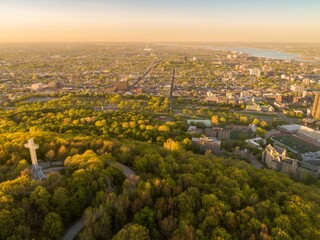 Obraz premium Aerial view of the Mount Royal Cross atop Mount Royal, overlooking Montreal, Canada. The cross is a landmark and symbol of the city, attracting tourists and locals alike.