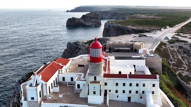 Explore the majestic lighthouse overlooking the cliffs of Algarve, Portugal with stunning coastal views