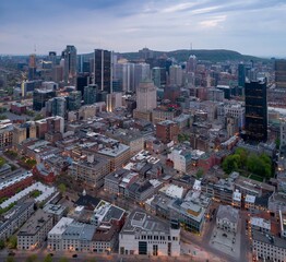 Montreal, Canada cityscape at dusk. Aerial view of the city's architecture, including skyscrapers...