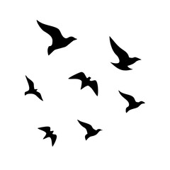 Silhouettes of birds in flight against a white background