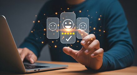Person in blue shirt touching a holographic interface with smiley faces, checkmark, and five stars, using a laptop, symbolizing online feedback.
