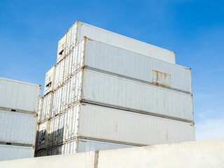 Cargo ship container goods export import international transport on blue sky background, warehouse...
