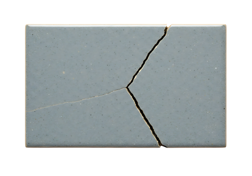 Cracked gray ceramic tile showing fragmentation and a linear split, ideal for representing breakage, damage, or texture.