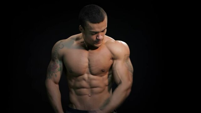 Confident bodybuilder showcasing impressive six-pack abs