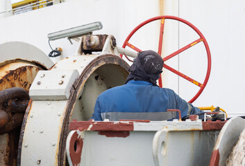 Grasing forward winch on board a ship