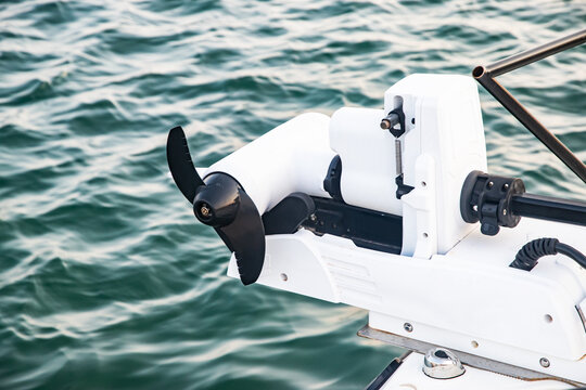 Modern small boat equipped with a bow-mounted electric trolling motor for quiet propulsion