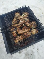 T-Bone Steak on Barbecue Grill Flames