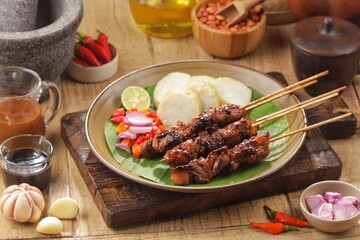 Sate Ayam. Chicken satay is a typical Indonesian food. Chicken satay is made from chicken meat. In general, chicken satay is cooked by grilling using charcoal and served with a choice of peanut sauce 