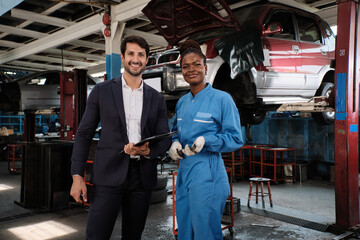 Portrait of professional partner, Latino male manager, and Black female mechanic smile, cheerful, cooperate service claim business, car fix warranty and maintenance at auto garage station industry.