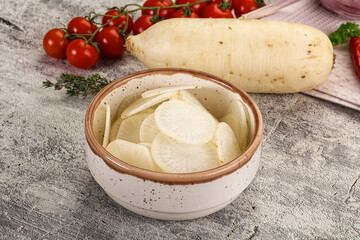 Sliced white daikon radish in the bowl