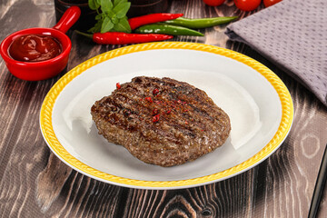 Grilled beef burger cutlet with sauce