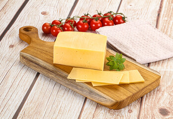 Yellow cheese piece with slices