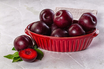 Raw ripe purple plum heap
