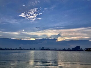 Peaceful Blue-Hour Reflection on West Lake with Hanoi City Skyline Silhouette, Vietnam