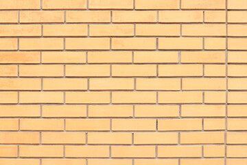 Brick wall texture, background. Orange brick wall background for exterior design. Construction concept, outdoor buildings, garage or house. Wall with classic checkerboard pattern and visible joints