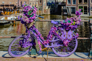 Purple bicycle with flowers in amsterdam