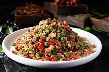 Stir-fried quinoa, barley, chopped pepper, cowpea and bacon