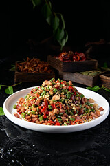 Stir-fried quinoa, barley, chopped pepper, cowpea and bacon
