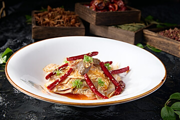 Spicy pork belly slices in red oil