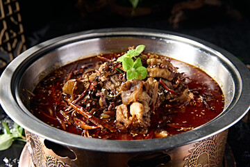 Spicy lamb head with red oil in pot