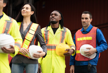 Group of engineer or workers at container site	