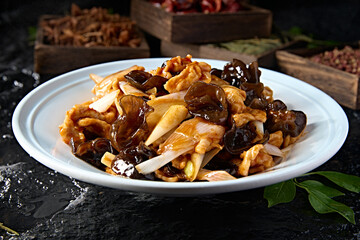 Chinese food: Braised pork with black fungus and green onion