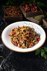 Hunan-style stir-fried sour beans, chopped peppers and garlic with chicken gizzards