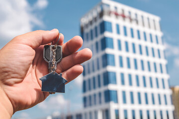 New Home Keys with Modern Building Background